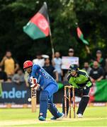 9 August 2022; Usman Ghani of Afghanistan and Ireland wicketkeeper Lorcan Tucker during the Men's T20 International match between Ireland and Afghanistan at Stormont in Belfast. Photo by Ramsey Cardy/Sportsfile
