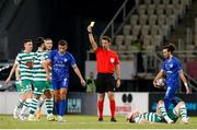 9 August 2022; Referee Aleksei Kulbakov shows a yellow card to Blerton Sheji of Shkupi for a foul on Aaron Greene of Shamrock Rovers during the UEFA Europa League third qualifying round second leg match between Shkupi and Shamrock Rovers at Arena Todor Proeski in Skopje, North Macedonia. Photo by Ognen Teofilovski/Sportsfile