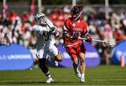 10 August 2022; Graydon Hogg of Canada in action against Danny Parker of USA during the 2022 World Lacrosse Men's U21 World Championship - Group A match between USA and Canada at the University of Limerick in Limerick. Photo by Tom Beary/Sportsfile