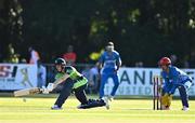 11 August 2022; Lorcan Tucker of Ireland plays a shot watched by Afghanistan wicketkeeper Rahmanullah Gurbaz during the Men's T20 International match between Ireland and Afghanistan at Stormont in Belfast. Photo by Sam Barnes/Sportsfile
