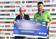 11 August 2022; Ireland captain Andrew Balbirnie is presented with the multibagger of the match award by Cricket Ireland president David Griffin during the Men's T20 International match between Ireland and Afghanistan at Stormont in Belfast. Photo by Sam Barnes/Sportsfile