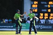 11 August 2022; George Dockrell of Ireland, right, and team-mate Gareth Delany celebrate after their side's victory in the Men's T20 International match between Ireland and Afghanistan at Stormont in Belfast. Photo by Sam Barnes/Sportsfile