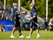 11 August 2022; Patrick Kavanagh, right, celebrates scoring a goal with Shane Knoblock of USA during the 2022 World Lacrosse Men's U21 World Championship - Group A match between USA and England at the University of Limerick in Limerick. Photo by Tom Beary/Sportsfile