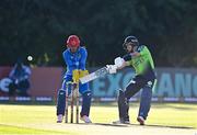 11 August 2022; Curtis Campher of Ireland plays a shot watched by Afghanistan wicketkeeper Rahmanullah Gurbaz during the Men's T20 International match between Ireland and Afghanistan at Stormont in Belfast. Photo by Sam Barnes/Sportsfile