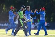 11 August 2022; Mujeeb Zadran of Afghanistan, centre, and team-mate Najibullah Zadran celebrate the wicket of Lorcan Tucker of Ireland during the Men's T20 International match between Ireland and Afghanistan at Stormont in Belfast. Photo by Sam Barnes/Sportsfile