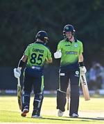 11 August 2022; George Dockrell of Ireland, right, and Curtis Campher bump fists during the Men's T20 International match between Ireland and Afghanistan at Stormont in Belfast. Photo by Sam Barnes/Sportsfile