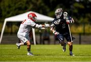11 August 2022; Cole Kirst of USA is tackled by Ed Loveland of England during the 2022 World Lacrosse Men's U21 World Championship - Group A match between USA and England at the University of Limerick in Limerick. Photo by Tom Beary/Sportsfile