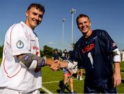 11 August 2022; Jared Paquette of USA and Dan Jones of England following the 2022 World Lacrosse Men's U21 World Championship - Group A match between USA and England at the University of Limerick in Limerick. Photo by Tom Beary/Sportsfile