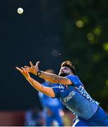 12 August 2022; Naveen ul Haq Murid of Afghanistan attempts to catch the shot by Gareth Delany of Ireland during the Men's T20 International match between Ireland and Afghanistan at Stormont in Belfast. Photo by Ramsey Cardy/Sportsfile
