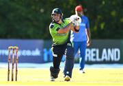 12 August 2022; Fionn Hand of Ireland hits a four during the Men's T20 International match between Ireland and Afghanistan at Stormont in Belfast. Photo by Ramsey Cardy/Sportsfile