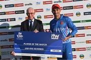 12 August 2022; Rahmanullah Gurbaz of Afghanistan is presented with the player of the match by Cricket Ireland president David Griffin after the Men's T20 International match between Ireland and Afghanistan at Stormont in Belfast. Photo by Ramsey Cardy/Sportsfile