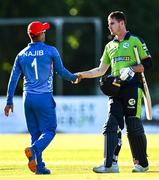 12 August 2022; Najibullah Zadran of Afghanistan and Josh Little of Ireland shake hands after the Men's T20 International match between Ireland and Afghanistan at Stormont in Belfast. Photo by Ramsey Cardy/Sportsfile