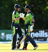 12 August 2022; George Dockrell, left, and Fionn Hand of Ireland during the Men's T20 International match between Ireland and Afghanistan at Stormont in Belfast. Photo by Ramsey Cardy/Sportsfile