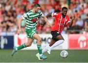 12 August 2022; Neil Farrugia of Shamrock Rovers in action against Sadou Diallo of Derry City during the SSE Airtricity League Premier Division match between Derry City and Shamrock Rovers at The Ryan McBride Brandywell Stadium in Derry. Photo by Stephen McCarthy/Sportsfile