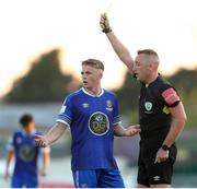 12 August 2022; Darragh Power of Waterford is shown a yellow card by referee Alan Patchell during the SSE Airtricity League First Division match between Waterford and Galway United at RSC in Waterford. Photo by Michael P Ryan/Sportsfile