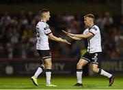 12 August 2022; Darragh Leahy of Dundalk, left, celebrates with team-mate Lewis Macari  after their side's victory in the SSE Airtricity League Premier Division match between Bohemians and Dundalk at Dalymount Park in Dublin. Photo by Sam Barnes/Sportsfile