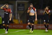 12 August 2022; Bohemians players, from left, Liam Burt, Ciarán Kelly and Josh Kerr leave the field dejected after their side's defeat in the SSE Airtricity League Premier Division match between Bohemians and Dundalk at Dalymount Park in Dublin. Photo by Sam Barnes/Sportsfile