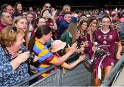 7 August 2022; Galway captain Lisa Casserly with the Jack McGrath Cup after her side's victory during the Glen Dimplex All-Ireland Intermediate Camogie Championship Final match between Cork and Galway at Croke Park in Dublin. Photo by Seb Daly/Sportsfile