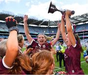 7 August 2022; Galway captain Lisa Casserly celebrates with the Jack McGrath Cup and her teammates after their side's victory in the Glen Dimplex All-Ireland Intermediate Camogie Championship Final match between Cork and Galway at Croke Park in Dublin. Photo by Seb Daly/Sportsfile