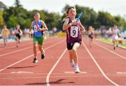 13 August 2022; Sadie Felle from Woodford-Tynagh, Galway, competes in the U10 4x100m Mixed Relay during the Aldi Community Games National Track and Field Finals that attract over 2,000 children to SETU Carlow Sports Campus in Carlow. Photo by Sam Barnes/Sportsfile