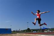 13 August 2022; Molly Thornton, from Mitchelstown, Cork, competing in the girls long jump u12 & o10 during the Aldi Community Games National Track and Field Finals that attract over 2,000 children to SETU Carlow Sports Campus in Carlow. Photo by Ramsey Cardy/Sportsfile