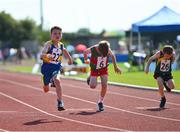 13 August 2022; Joe Rooney, from Edgeworthstown, Longford, crosses the finish line to win the boys 60m U8 & O6 during the Aldi Community Games National Track and Field Finals that attract over 2,000 children to SETU Carlow Sports Campus in Carlow. Photo by Ramsey Cardy/Sportsfile