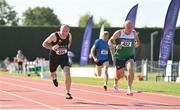 13 August 2022; Finbarr Whelan of Liscarroll AC, right, and Neil Kingston of Eagle AC dip for the line whilst competing in the men's vet50 100 metres  during the Irish Life Health National Masters Track and Field Championships in Tullamore, Offaly. Photo by Seb Daly/Sportsfile