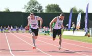 13 August 2022; Brian Malone of Craughwell AC, left, and Cormac Kearney of Craughwell AC, competing in the men's vet45 100 metres during the Irish Life Health National Masters Track and Field Championships in Tullamore, Offaly. Photo by Seb Daly/Sportsfile