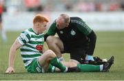 12 August 2022; Rory Gaffney of Shamrock Rovers receives medical attention from physiotherapist Tony McCarthy during the SSE Airtricity League Premier Division match between Derry City and Shamrock Rovers at The Ryan McBride Brandywell Stadium in Derry. Photo by Stephen McCarthy/Sportsfile