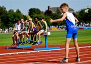 13 August 2022; Athletes watch on during the u12 4x100m boys relay at the Aldi Community Games National Track and Field Finals that attract over 2,000 children to SETU Carlow Sports Campus in Carlow. Photo by Ramsey Cardy/Sportsfile