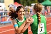 13 August 2022; Isbeal Na´ Huiga´n, left, and Megan O’ Shea, from Crecora-Patrickswell, Limerick, celebrate after competing in the U13 4x100m mixed relay during the Aldi Community Games National Track and Field Finals that attract over 2,000 children to SETU Carlow Sports Campus in Carlow. Photo by Sam Barnes/Sportsfile