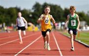 13 August 2022; Rhys Cusack from Ennis-St-Johns, Clare, centre, competing in the U12 4x100m boys relay during the Aldi Community Games National Track and Field Finals that attract over 2,000 children to SETU Carlow Sports Campus in Carlow. Photo by Sam Barnes/Sportsfile