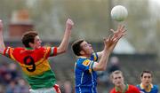 9 May 2004; Liam Kennan, Longford, in action against Thomas Walsh, Carlow. Bank of Ireland Leinster Senior Football Championship, Carlow v Longford, O'Connor Park, Tullamore, Co. Offaly. Picture credit; David Maher / SPORTSFILE