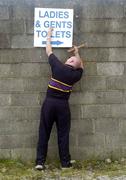 23 May 2004; Carpenter Philip Mullen fixes a sign before the game. Bank of Ireland Connacht Senior Football Championship, Roscommon v Sligo, Dr. Hyde Park, Co. Roscommon. Picture credit; Ray McManus / SPORTSFILE