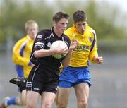 23 May 2004; Michael Gormley, Sligo, is tackled by Niall Grehan, Roscommon. Connacht Minor Football Championship, Roscommon v Sligo, Dr. Hyde Park, Co. Roscommon. Picture credit; Ray McManus / SPORTSFILE