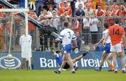 23 May 2004; Armagh's Steven McDonnell, out of picture,  beats Monaghan goalkeeper Glenn Murphy to score his side's first goal. Bank of Ireland Ulster Senior Football Championship, Monaghan v Armagh, St. Tighernach's Park, Clones, Co. Monaghan. Picture credit; Damien Eagers / SPORTSFILE