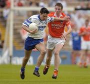 23 May 2004; Stephen McAleer, Monaghan, in action against Gareth O'Neill, Armagh. Ulster Minor Football Championship, Monaghan v Armagh, St. Tighernach's Park, Clones, Co. Monaghan. Picture credit; Pat Murphy / SPORTSFILE