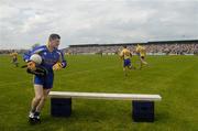 23 May 2004; Roscommon captain Shane Curran leads his team to the bench for the team photograph. Bank of Ireland Connacht Senior Football Championship, Roscommon v Sligo, Dr. Hyde Park, Co. Roscommon. Picture credit; Ray McManus / SPORTSFILE