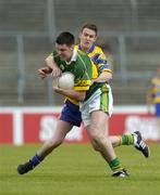 23 May 2004; Ivor Flynn, Kerry, in action against Danny Lynch, Clare. Munster Junior Football Championship, Clare v Kerry, Cusack Park, Ennis, Co. Clare. Picture credit; Brendan Moran / SPORTSFILE