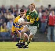 23 May 2004; Colm Cooper, Kerry, in action against Padraig Gallagher, Clare. Bank of Ireland Munster Senior Football Championship, Clare v Kerry, Cusack Park, Ennis, Co. Clare. Picture credit; Brendan Moran / SPORTSFILE