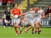 10 August 2013; Siobhan Mackle, Armagh, in action against Rena Buckley, Cork. TG4 All-Ireland Ladies Football Senior Championship, Round 2, Qualifier, Armagh v Cork, St. Brendan’s Park, Birr, Co. Offaly. Photo by Sportsfile