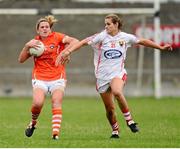 10 August 2013; Sinead McCleary, Armagh, in action against Sarah Harrington, Cork. TG4 All-Ireland Ladies Football Senior Championship, Round 2, Qualifier, Armagh v Cork, St. Brendan’s Park, Birr, Co. Offaly. Photo by Sportsfile
