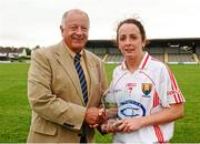 10 August 2013; Geraldine O'Flynn, Cork, is presented with the player of the match award by Pat Quill, President of the Ladies Gaelic Football Association. TG4 All-Ireland Ladies Football Senior Championship, Round 2, Qualifier, Armagh v Cork, St. Brendan’s Park, Birr, Co. Offaly. Photo by Sportsfile