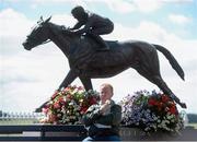 11 August 2013; A racegoer enjoys an ice cream before the Irish Stallion Farms European Breeders Fund Fillies Maiden. Curragh Racecourse, The Curragh, Co. Kildare. Picture credit: Brian Lawless / SPORTSFILE