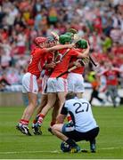 11 August 2013; Cork players celebrate victory as a dejected Simon Lambert, Dublin, ponders what might have been after the game. GAA Hurling All-Ireland Senior Championship, Semi-Final, Dublin v Cork, Croke Park, Dublin. Picture credit: Ray McManus / SPORTSFILE