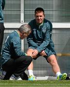 12 August 2013; Republic of Ireland team doctor Alan Byrne attends to James McCarthy during squad training ahead of their international friendly against Wales on Wednesday. Republic of Ireland Squad Training, Spytty Park, Newport, Wales. Picture credit: David Maher / SPORTSFILE
