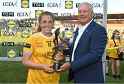 13 August 2022; Cathy Carey of Antrim receives the Player of the Match award from Alan Esslemont, Director General, TG4, following the TG4 All-Ireland Ladies Junior Football Championship Final Replay between Antrim and Fermanagh at the Athletic Grounds, Armagh. Photo by Oliver McVeigh/Sportsfile