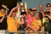 13 August 2022; Cathy Carey, left, and Grainne McLaughlin of Antrim lift the West County Hotel Cup with 4 year old Daithi MacGabhann following the TG4 All-Ireland Ladies Junior Football Championship Final Replay between Antrim and Fermanagh at the Athletic Grounds, Armagh. Photo by Oliver McVeigh/Sportsfile
