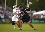 13 August 2022; Efrain Barreto JR of Haudenosaunee is tackled by Danny Parker of USA during the 2022 World Lacrosse Men's U21 World Championship - Pool A match between USA and Haudenosaunee at University of Limerick. Photo by Tom Beary/Sportsfile