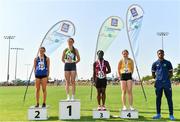 13 August 2022; Community Games ambassador Jesse Osas, right, with girls 100m U16 & O14 medallists, Leila Colfer from Rathvilly, Carlow, gold, Sarah Kiernan from Lakeside, Wicklow, silver, Ayulley Amentorge from Kinnegad-Coralstown, Westmeath, bronze, and Alexandra Ward from Ennis-St-Johns, Clare, fourth, during the Aldi Community Games National Track and Field Finals that attract over 2,000 children to SETU Carlow Sports Campus in Carlow. Photo by Sam Barnes/Sportsfile